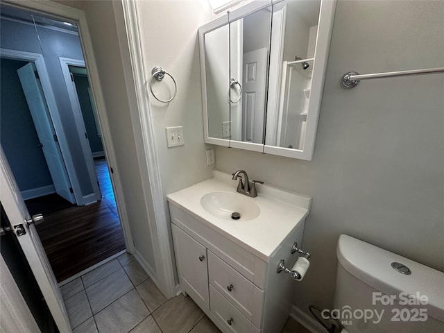 1119 Sanders St, Rock Hill, SC 29732 - bathroom featuring tile patterned floors, toilet, baseboards, and vanity