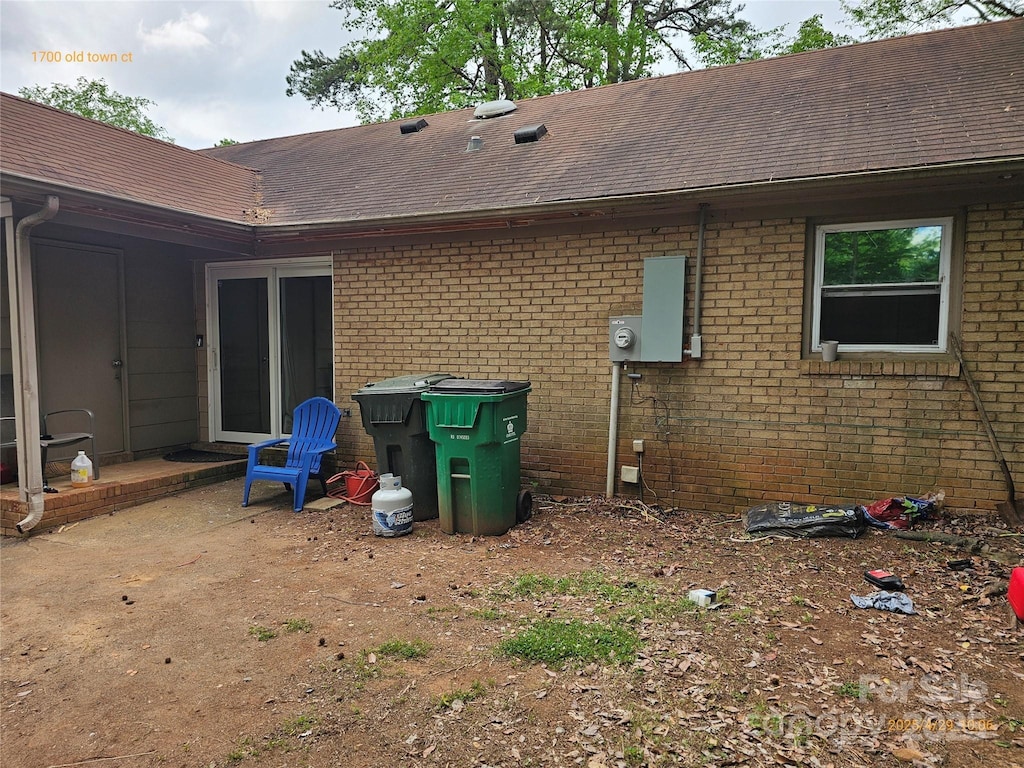 1700 Old Towne Ct, Charlotte, NC 28217 - back of property featuring roof with shingles and brick siding