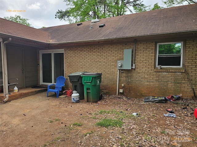 1700 Old Towne Ct, Charlotte, NC 28217 - back of property featuring roof with shingles and brick siding