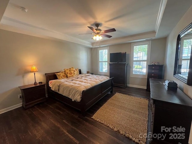 bedroom with crown molding, dark wood-type flooring, multiple windows, and baseboards