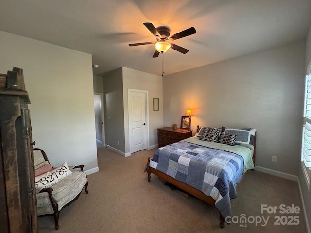 bedroom with carpet floors, baseboards, and ceiling fan