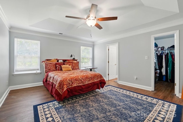 10431 Plantain Ct, Charlotte, NC 28213 - bedroom with a tray ceiling, wood finished floors, ornamental molding, baseboards, and a spacious closet
