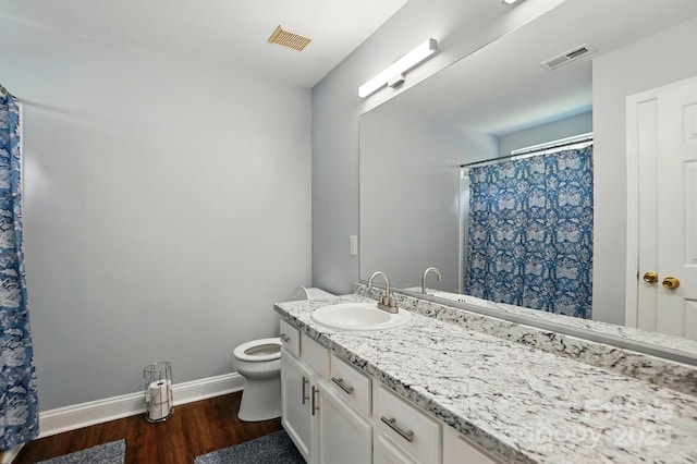10431 Plantain Ct, Charlotte, NC 28213 - bathroom featuring baseboards, wood finished floors, vanity, toilet, and curtained shower
