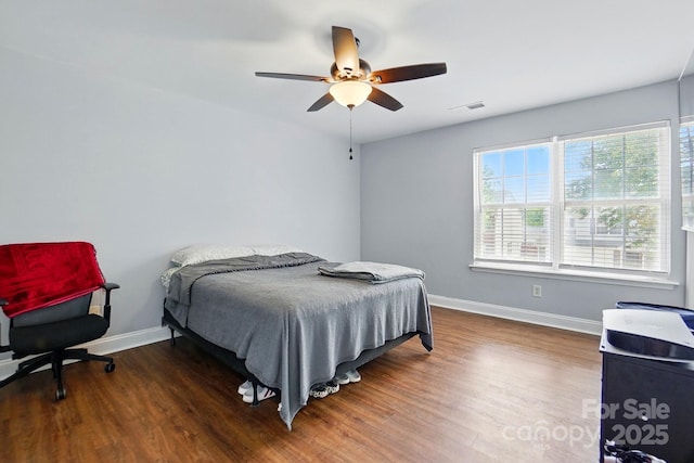 10431 Plantain Ct, Charlotte, NC 28213 - bedroom with baseboards, wood finished floors, and a ceiling fan