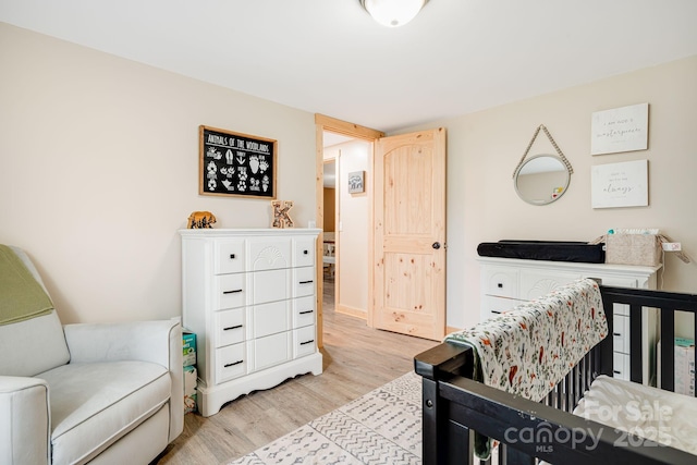 145 Avery St, Waynesville, NC 28786 - bedroom featuring light wood-style flooring