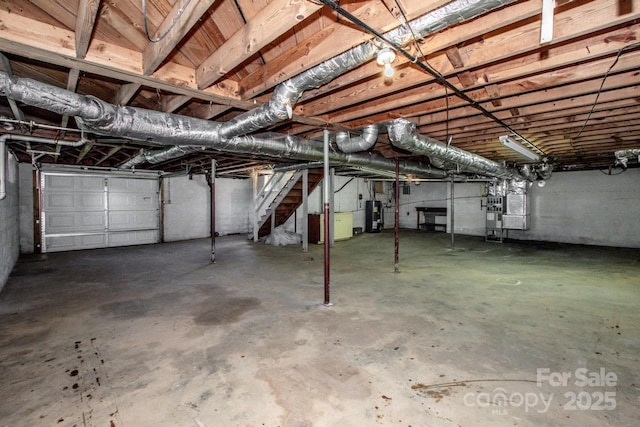 below grade area with stairs and water heater