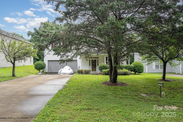 10016 Lawing School Rd, Charlotte, NC 28214 - obstructed view of property with driveway, a front yard, and a garage