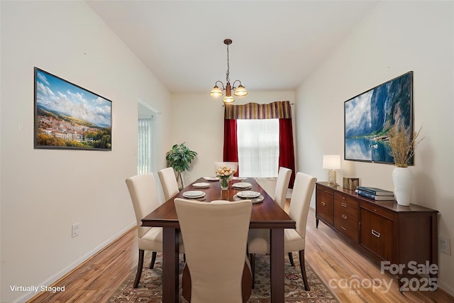 10016 Lawing School Rd, Charlotte, NC 28214 - dining area with light wood-style floors and a chandelier