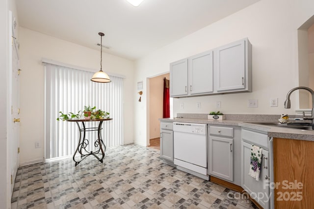 10016 Lawing School Rd, Charlotte, NC 28214 - kitchen featuring dishwasher, hanging light fixtures, and light countertops