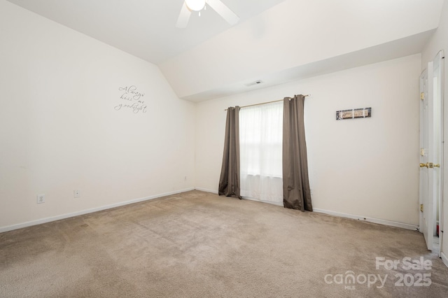 10016 Lawing School Rd, Charlotte, NC 28214 - carpeted spare room with vaulted ceiling and ceiling fan