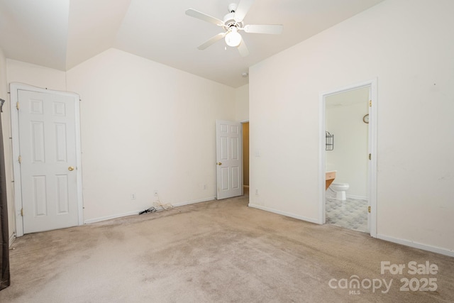 10016 Lawing School Rd, Charlotte, NC 28214 - unfurnished bedroom with vaulted ceiling, carpet, and ensuite bath