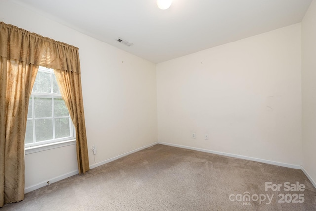 10016 Lawing School Rd, Charlotte, NC 28214 - empty room featuring light carpet and baseboards