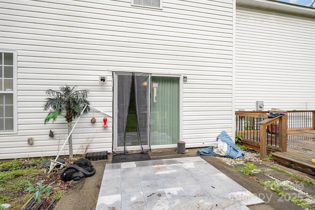 10016 Lawing School Rd, Charlotte, NC 28214 - doorway to property with a patio area and a wooden deck