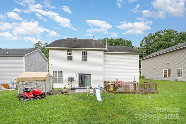 10016 Lawing School Rd, Charlotte, NC 28214 - back of property with a lawn and a deck