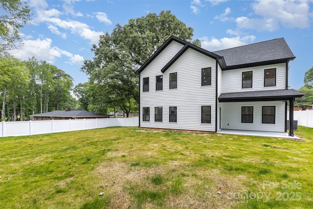 9527 Walkers Ferry Rd, Charlotte, NC 28214 - back of property featuring a patio and roof with shingles