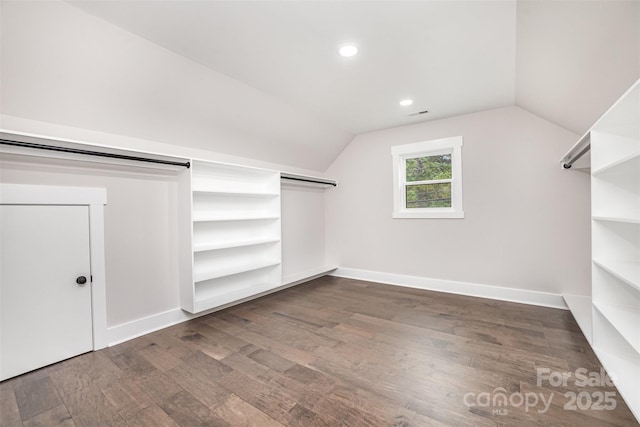 9527 Walkers Ferry Rd, Charlotte, NC 28214 - spacious closet with lofted ceiling and dark wood-type flooring