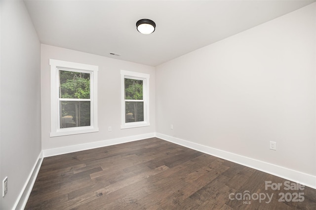 9527 Walkers Ferry Rd, Charlotte, NC 28214 - empty room featuring dark wood-style flooring and baseboards