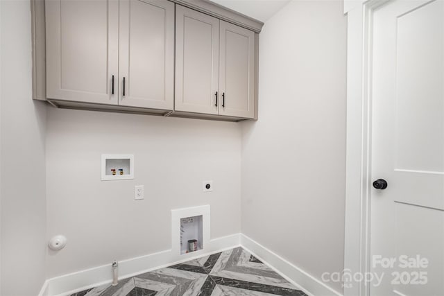 9527 Walkers Ferry Rd, Charlotte, NC 28214 - laundry area featuring hookup for a gas dryer, marble look tile flooring, hookup for a washing machine, cabinet space, and hookup for an electric dryer