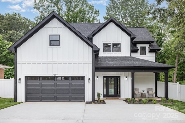 9527 Walkers Ferry Rd, Charlotte, NC 28214 - modern farmhouse style home with a shingled roof, board and batten siding, concrete driveway, and covered porch