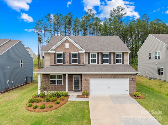 191 Tackle Box Dr, Troutman, NC 28166 - view of front of home with brick siding, concrete driveway, a garage, and a front lawn