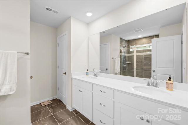 191 Tackle Box Dr, Troutman, NC 28166 - bathroom with a stall shower, double vanity, and baseboards