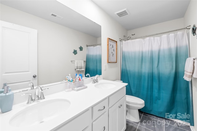 191 Tackle Box Dr, Troutman, NC 28166 - bathroom featuring tile patterned flooring, toilet, double vanity, and a shower with curtain
