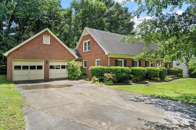 8017 Prince George Rd, Charlotte, NC 28210 - view of front of home featuring brick siding, driveway, a front yard, roof with shingles, and a garage