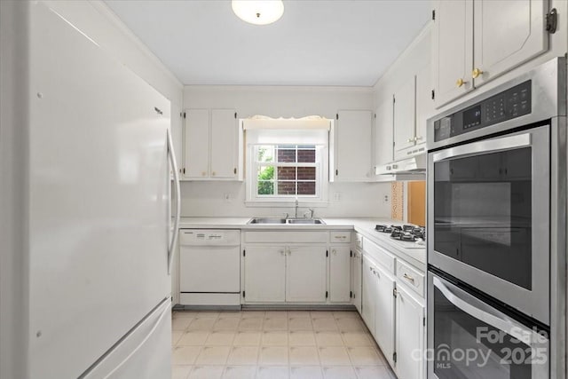 8017 Prince George Rd, Charlotte, NC 28210 - kitchen with white appliances, a sink, light countertops, white cabinets, and ornamental molding