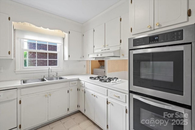 8017 Prince George Rd, Charlotte, NC 28210 - kitchen featuring under cabinet range hood, white appliances, a sink, crown molding, and white cabinets