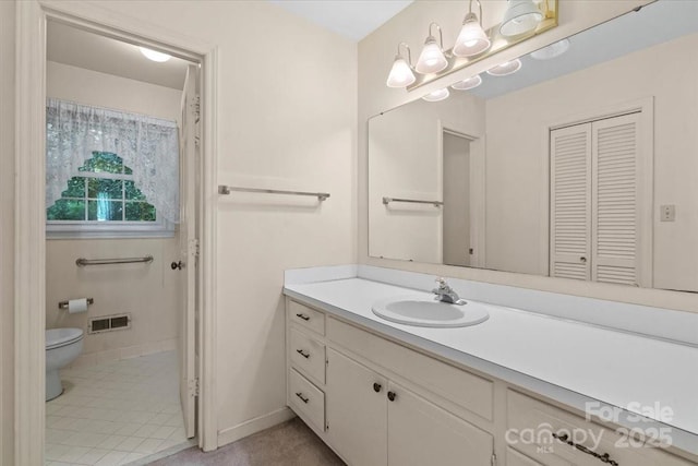 8017 Prince George Rd, Charlotte, NC 28210 - bathroom featuring toilet, vanity, a closet, and baseboards