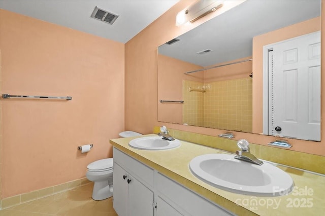 8017 Prince George Rd, Charlotte, NC 28210 - bathroom featuring double vanity, toilet, a shower, tile patterned flooring, and baseboards