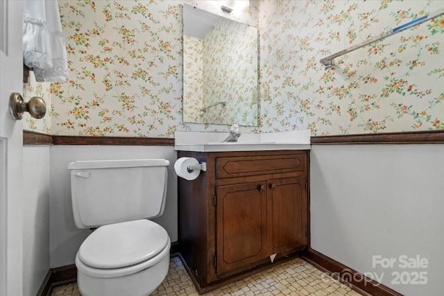 8017 Prince George Rd, Charlotte, NC 28210 - bathroom with baseboards, toilet, wallpapered walls, and vanity