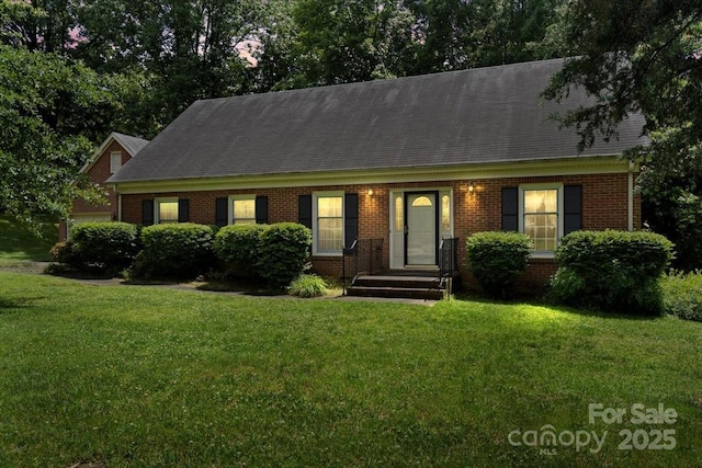 8017 Prince George Rd, Charlotte, NC 28210 - cape cod home with brick siding, a front lawn, and a shingled roof