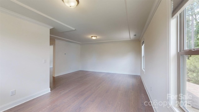 14506 Knowledge Cir, Charlotte, NC 28277 - spare room featuring wood finished floors, baseboards, and crown molding