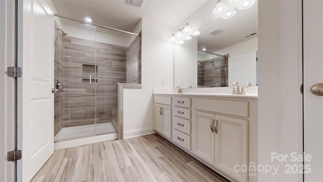 14506 Knowledge Cir, Charlotte, NC 28277 - bathroom with a stall shower, double vanity, and baseboards