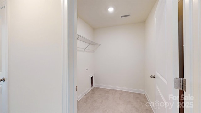 14506 Knowledge Cir, Charlotte, NC 28277 - laundry area featuring electric dryer hookup, baseboards, recessed lighting, and light tile patterned floors