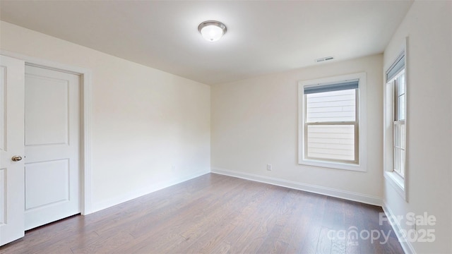 14506 Knowledge Cir, Charlotte, NC 28277 - empty room featuring dark wood-type flooring and baseboards