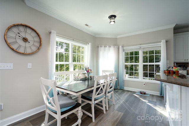 126 Strand Rd, New London, NC 28127 - dining area featuring baseboards, dark wood-type flooring, and crown molding
