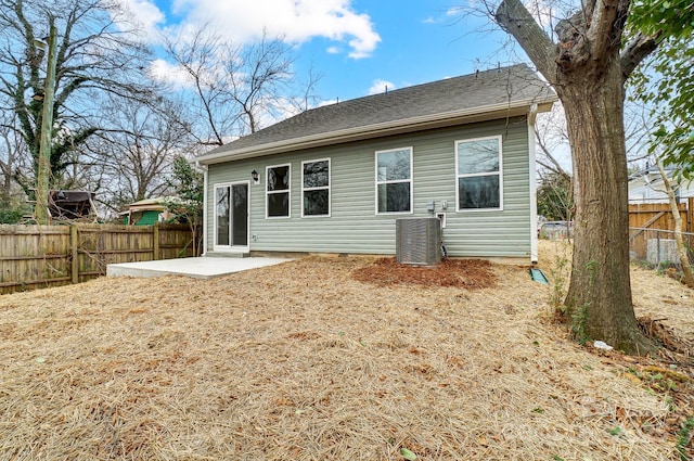 back of property featuring a patio area, cooling unit, and a fenced backyard