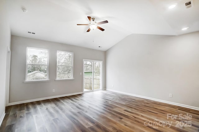 unfurnished room with vaulted ceiling, baseboards, a ceiling fan, and wood finished floors