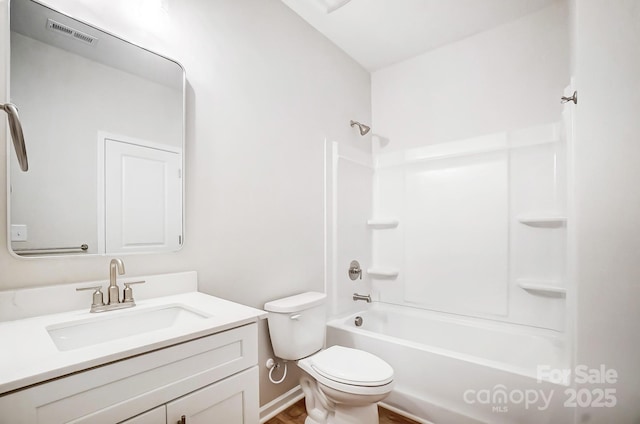 full bathroom with shower / bathtub combination, toilet, visible vents, vanity, and wood finished floors