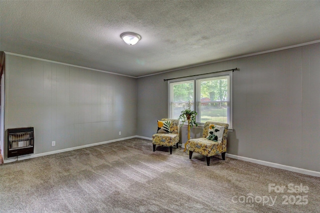 living area featuring a textured ceiling, crown molding, heating unit, carpet flooring, and baseboards