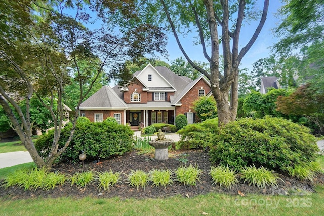 5718 Bardsey Ct, Matthews, NC 28104 - traditional-style house featuring brick siding and covered porch