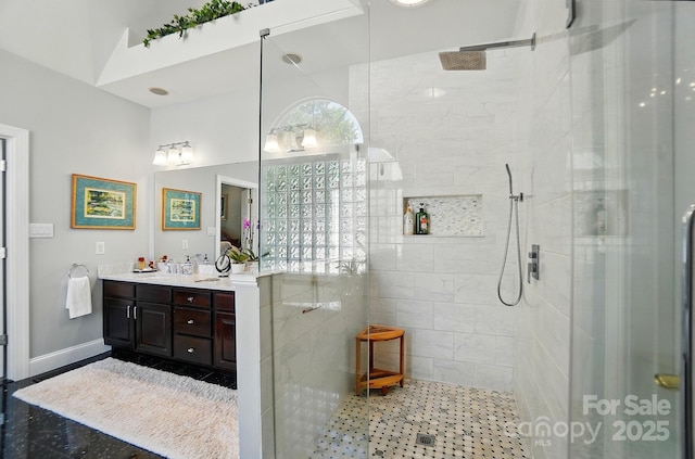 5718 Bardsey Ct, Matthews, NC 28104 - full bath featuring double vanity, a walk in shower, and baseboards