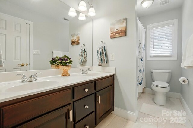 5718 Bardsey Ct, Matthews, NC 28104 - full bath featuring double vanity, tile patterned floors, toilet, baseboards, and a shower with shower curtain