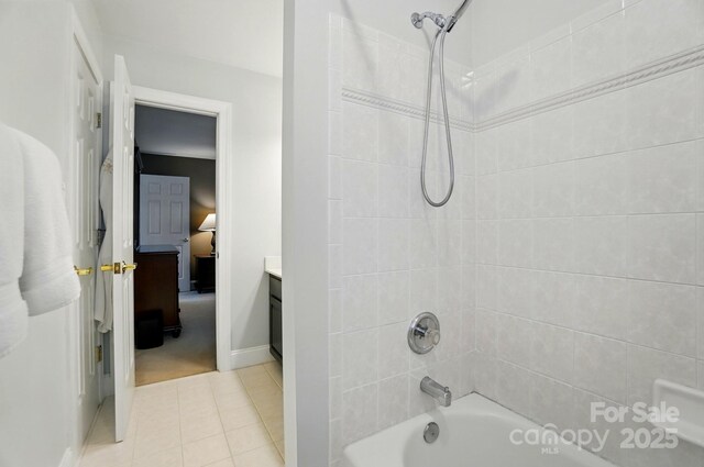 5718 Bardsey Ct, Matthews, NC 28104 - full bathroom featuring shower / washtub combination, connected bathroom, tile patterned floors, vanity, and baseboards
