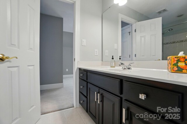 5718 Bardsey Ct, Matthews, NC 28104 - full bathroom with vanity, tile patterned flooring, a shower, and baseboards