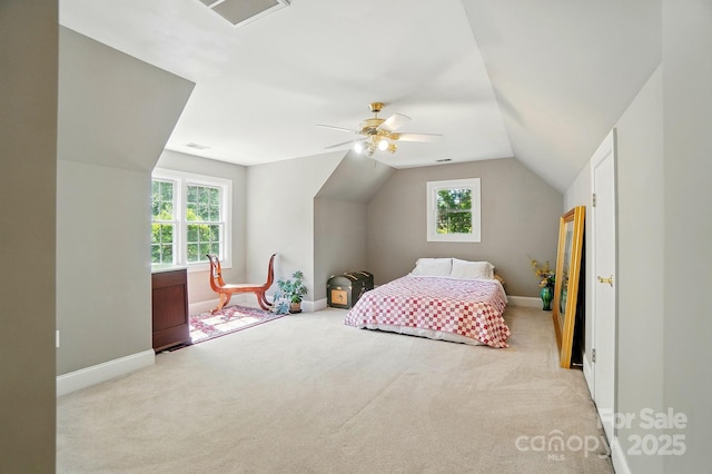 5718 Bardsey Ct, Matthews, NC 28104 - carpeted bedroom featuring vaulted ceiling, baseboards, and ceiling fan
