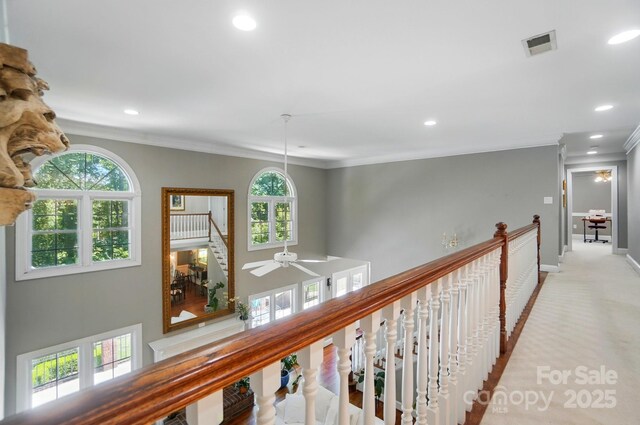 5718 Bardsey Ct, Matthews, NC 28104 - corridor featuring recessed lighting, crown molding, healthy amount of natural light, baseboards, and light carpet