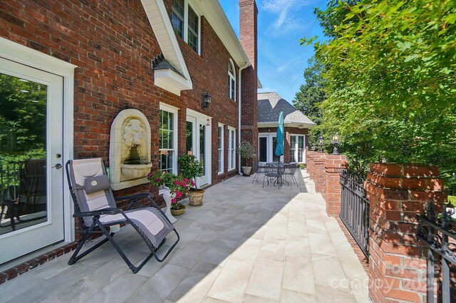 5718 Bardsey Ct, Matthews, NC 28104 - view of patio with outdoor dining space and french doors